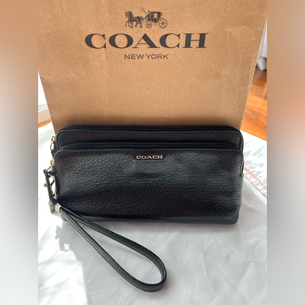 Black leather Coach wrist phone wallet. In excellent condition.